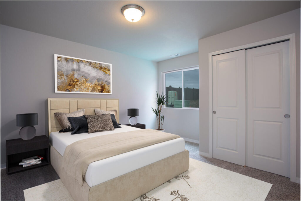 Staged bedroom with beige upholstered bed, two dark nightstands, and framed artwork above headboard.