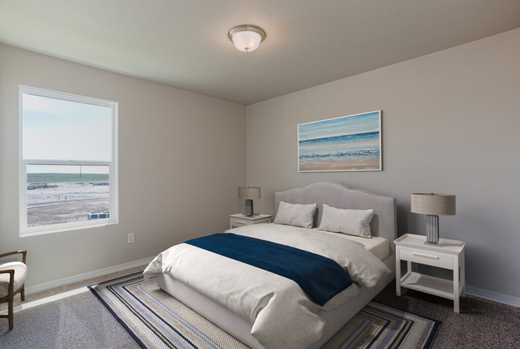 Bedroom with upholstered headboard, white bedding, navy throw, two nightstands and a window with outside view.