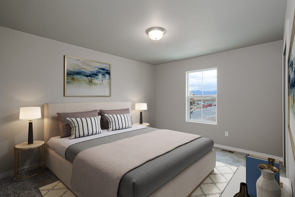 Bedroom with bed, bedside tables and lamps, wall art, and a single window with street view.