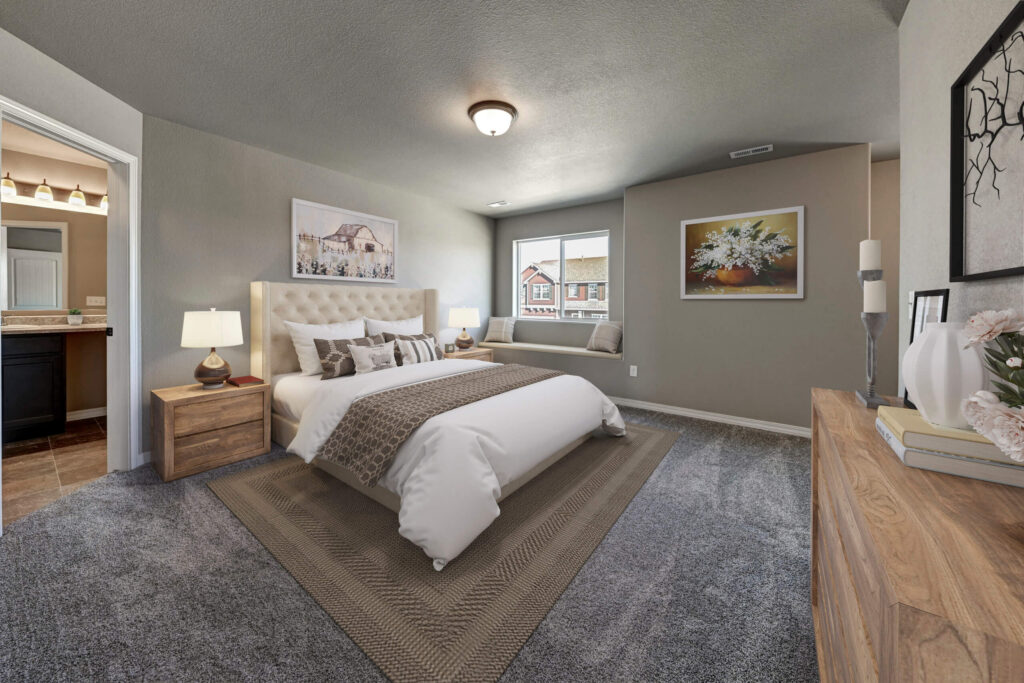 Staged bedroom with neutral tones, tufted headboard, bedside lamps, and window seat.